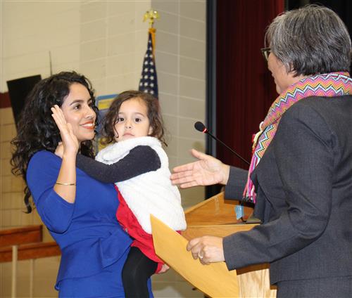 Newly-elected school board member Stephanie Hernandez-Jarvis is swore in by Pinole City Council member Norma Martinez-Rubin 